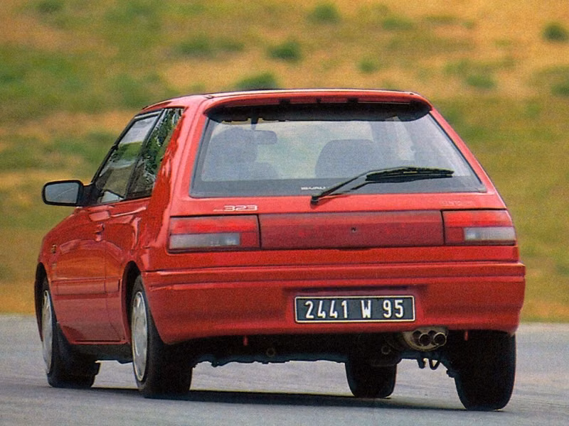 Mazda 323 IV (BG)، هاتشباك 3 أبواب — منظر خلفي أيسر